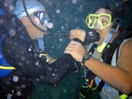 Image of 2 divers sharing air