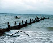 Image of tide swamping pier in storm