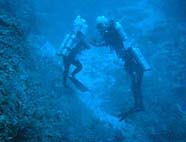 Image of divers at app. 200 feet depth.